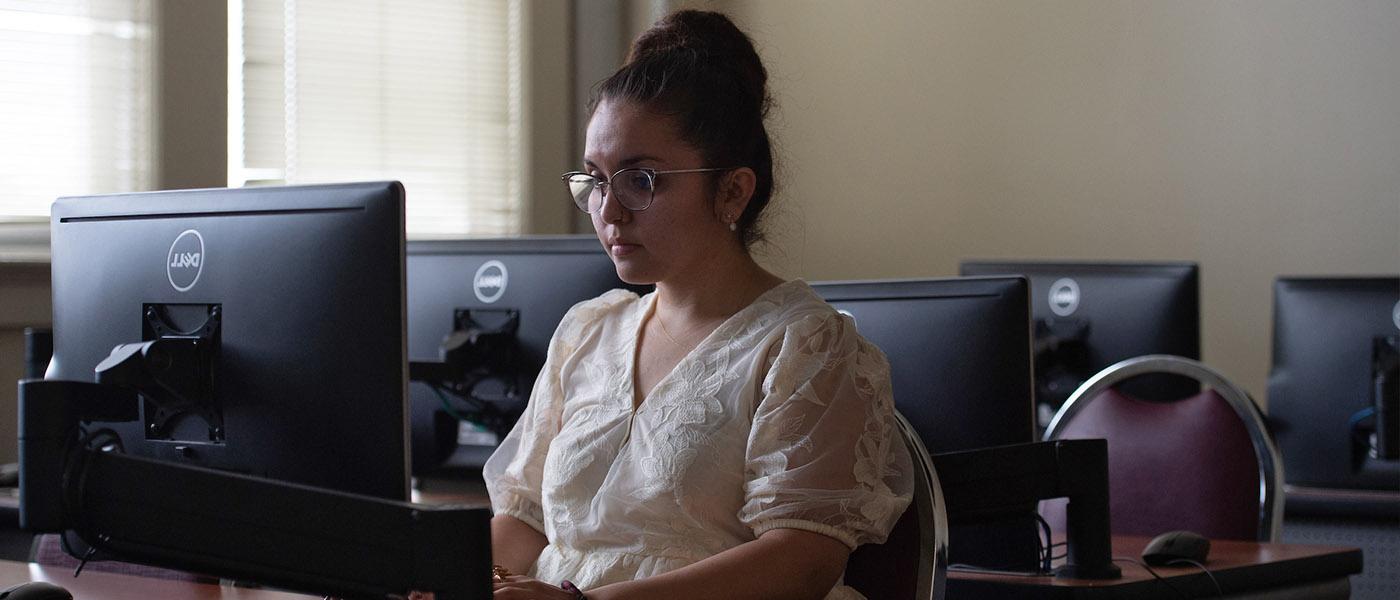 Psychology student working in a computer lab