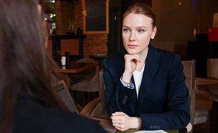 stock image of woman in meeting