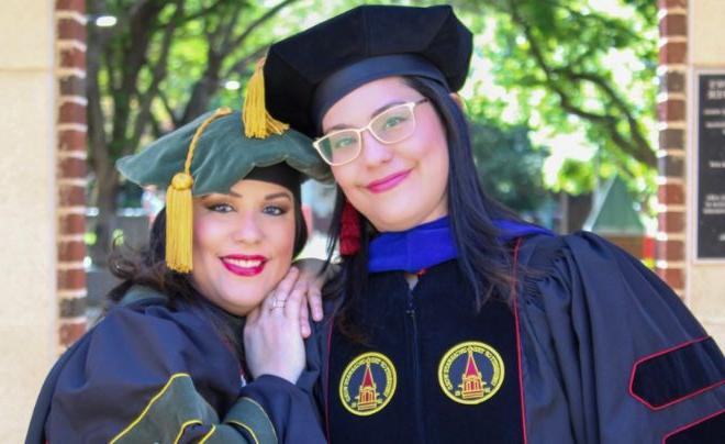 Silva sisters in graduation regalia