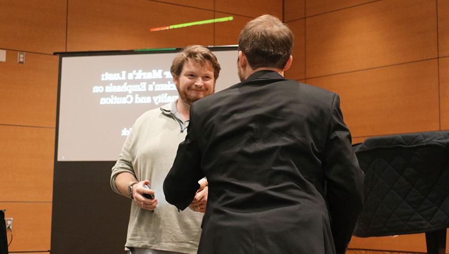 Rerick shaking hands with Dr. Kainer